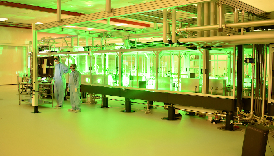 two scientists in front of the Extreme light infrastructure facility