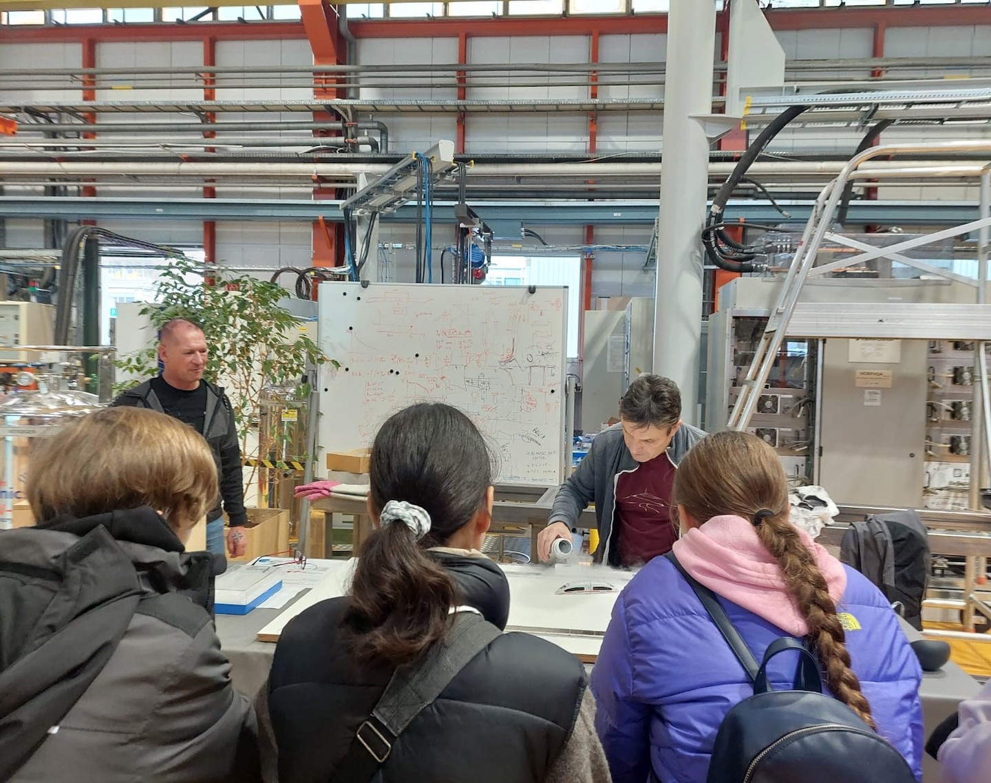 Schoolchildren looking at a science experiment.