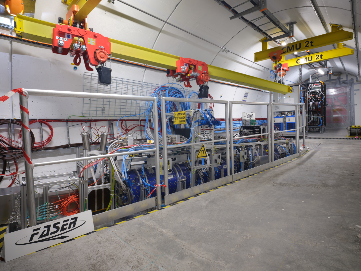 View of the Faser experimental set-up - silver apparatus, connectors and blue cables - in an underground gallery