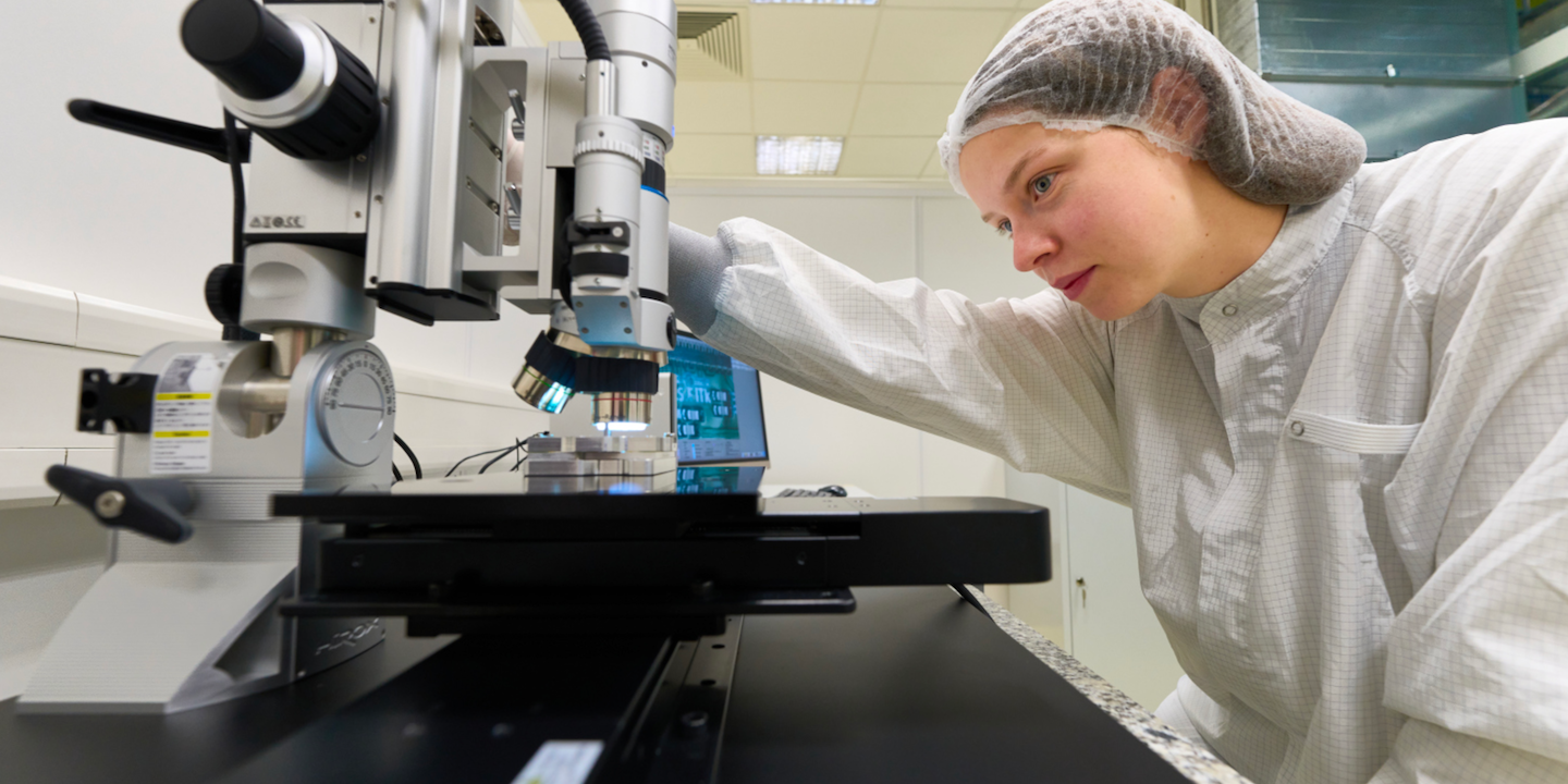 Jenny Lunde, in a clean room working on pixel chips for the ATLAS detector