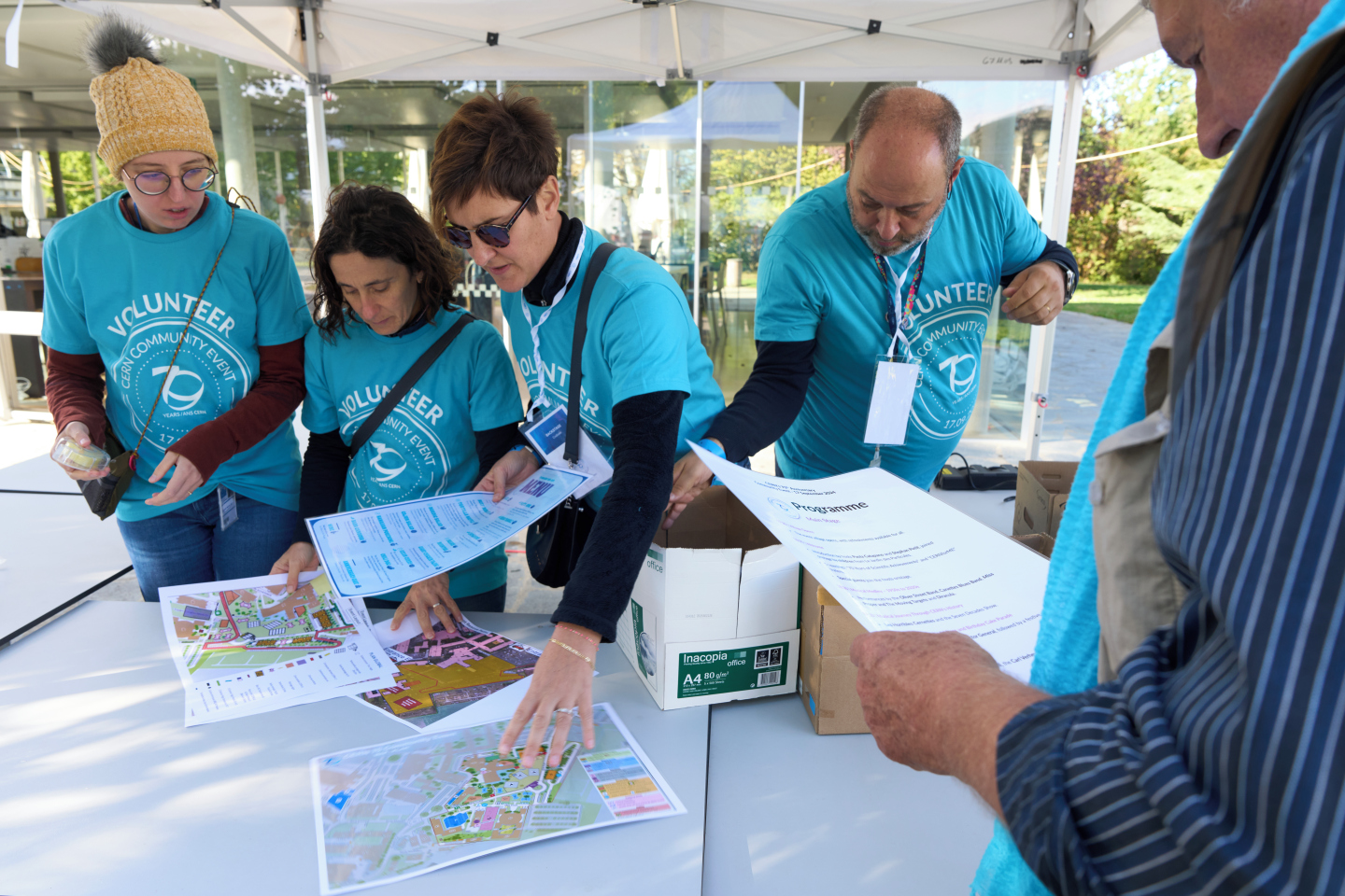 4 volunteers at an info stand
