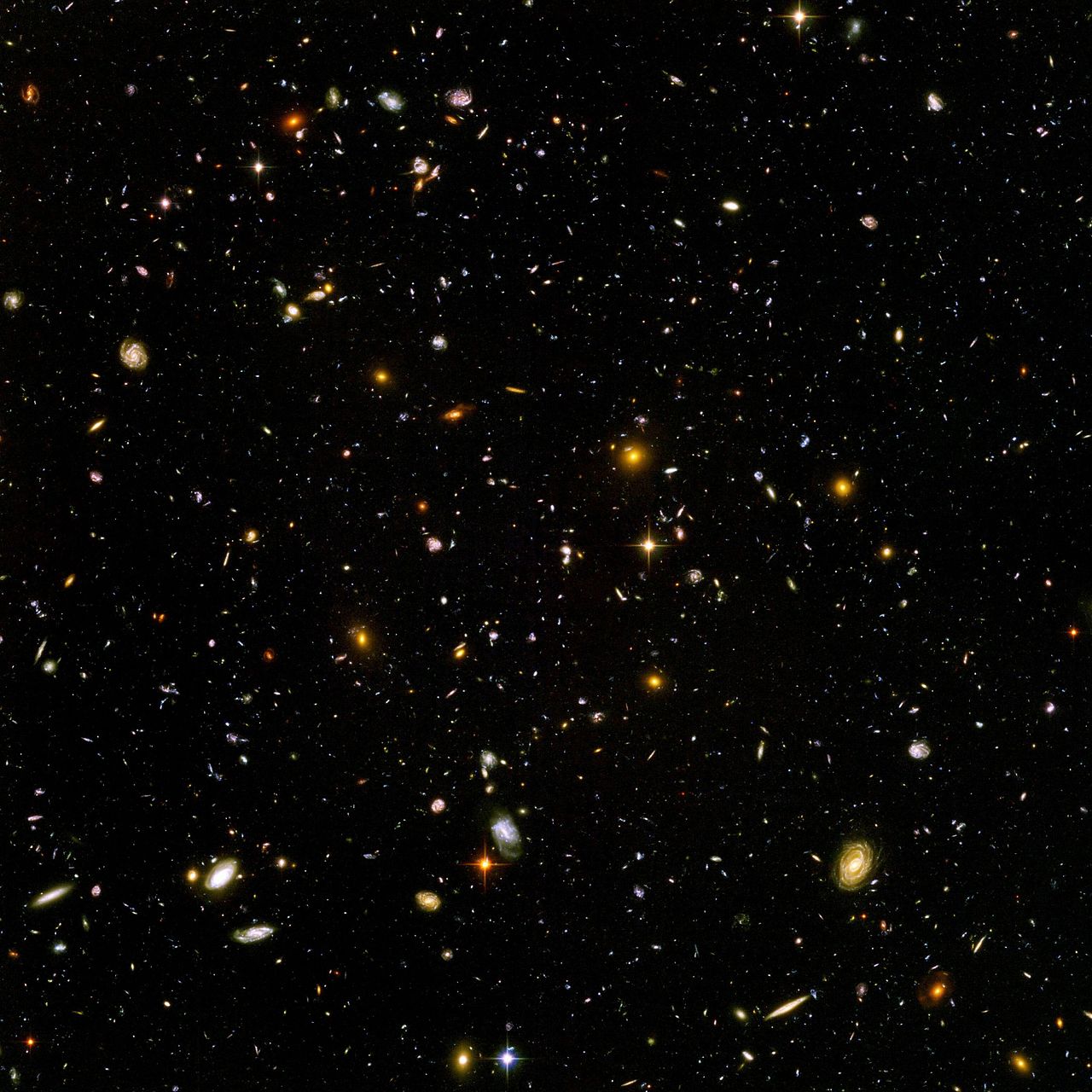 The Hubble Ultra Deep Field, is an image of a small region of space in the constellation Fornax, composited from Hubble Space Telescope data accumulated over a period from September 3, 2003 through January 16, 2004. The patch of sky in which the galaxies reside was chosen because it had a low density of bright stars in the near-field. Image credit: NASA and the European Space Agency