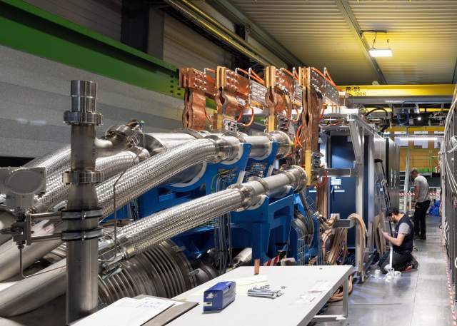 “Pit Stop” by Marc Goodwin. The HL-LHC cold powering system.